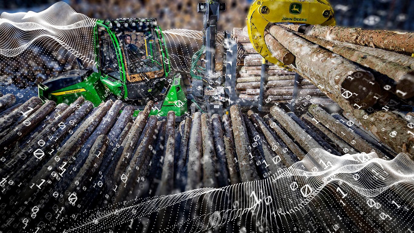 John Deere 910G e pilhas de madeira